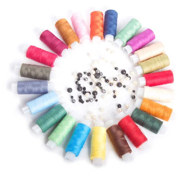 stock image Colorful threads and beads on white
