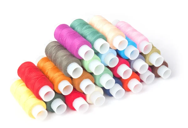 Colorful threads on a white — Stock Photo, Image