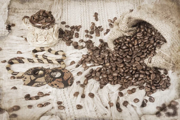 Ceramic cup of coffee, roasted coffee beans and wooden bijouteri — Stock Photo, Image