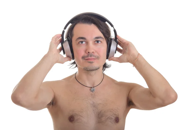 Mladý muž v stereo sluchátka, izolovaných na bílém poz — Stock fotografie