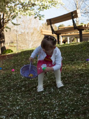 Toddler on Easter Egg Hunt clipart