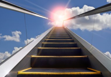 Moving staircase and blue sky clipart