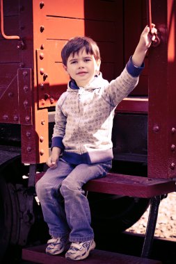 Boy and an old train clipart