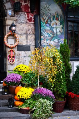 Decoration of the house in the old town. Halloween Warsaw. Poland clipart