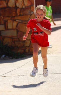 Little girl athlete running clipart