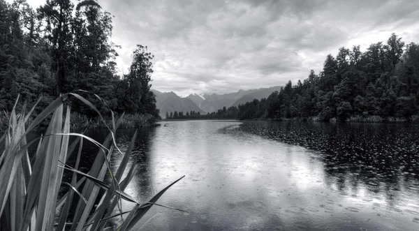 stock image Lake Matheson Nestled in New Zealand Mountains