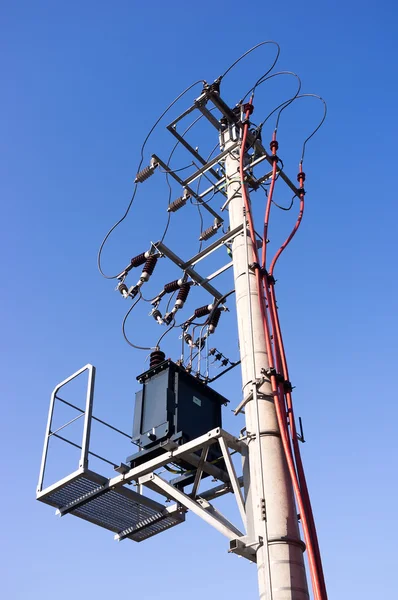 stock image Electric pole on a blue sky background