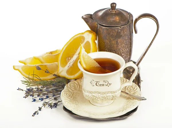 Tea in cup and lemon — Stock Photo, Image