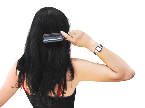 stock image Young brunette brushing her hair