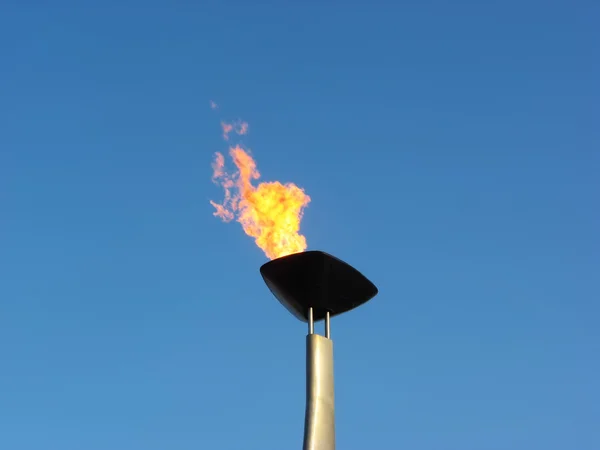 Олимпийский факел с огнём Стоковая Картинка