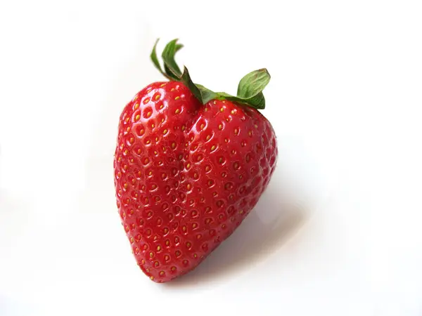 A single red strawberry isolated in white — Stock Photo, Image