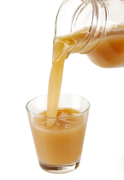 Pear juice is poured — Stock Photo, Image