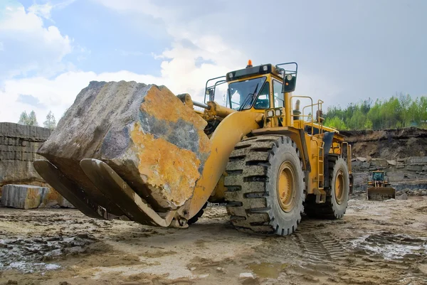 Excavation with a big stone — Stock Photo, Image