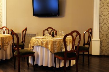 Table with glasses at restaurant clipart