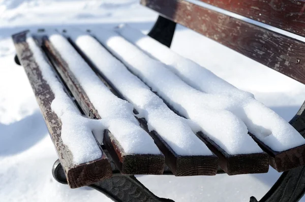 stock image Snow on a shop in park