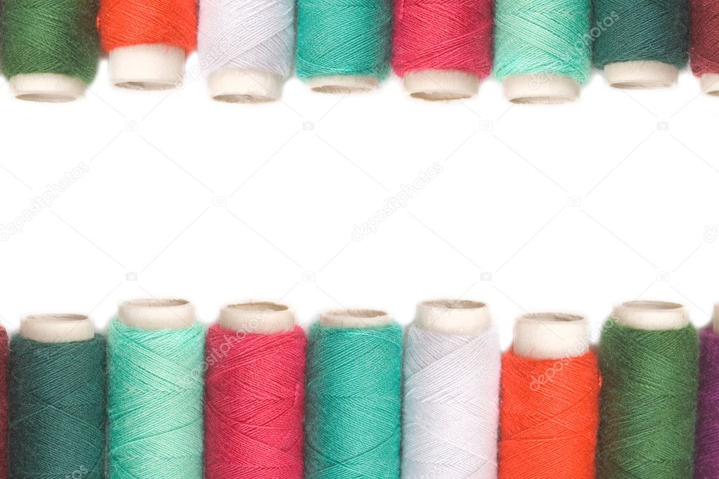 Color thread reels over white background