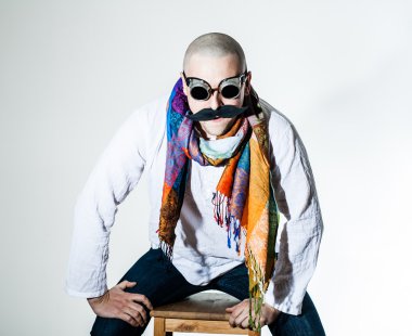 Man with false moustache and colored scarf clipart