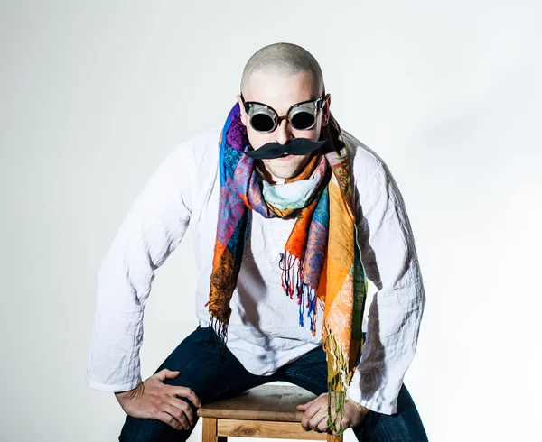 stock image Man with false moustache and colored scarf