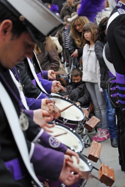 GRANADA, ANDALUSIA, SPAIN - APRIL 6: Music band the penitents of the brotherhood in typical procession Holy Week in April 6, 2012 in Granada, Andalusia, Spain clipart