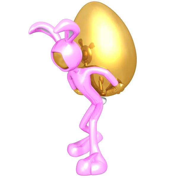 Osterhase trägt riesiges goldenes Ei — Stockfoto