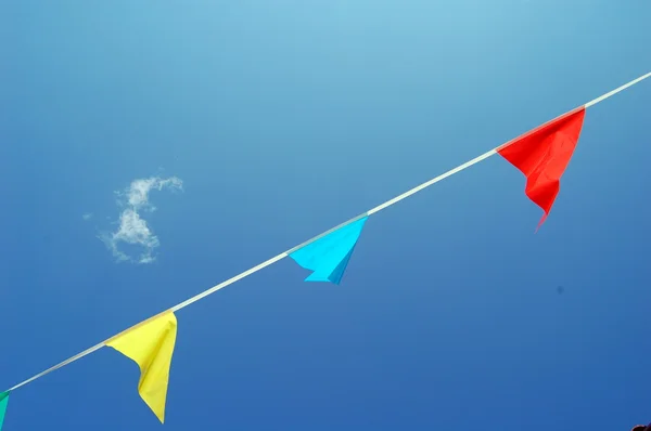 Party flags of various color in the wind — Stock Photo, Image
