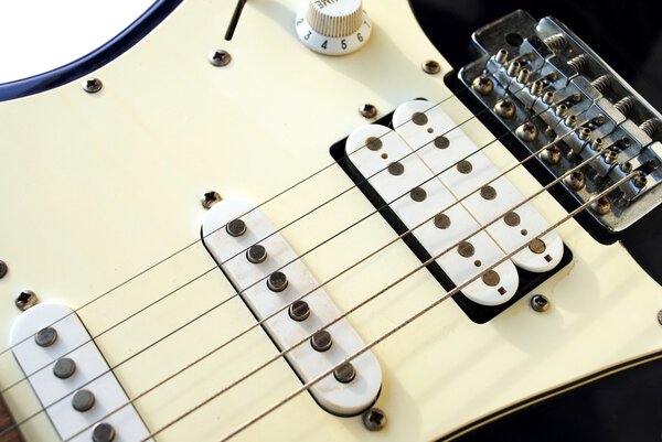Close up of an old style electric guitar