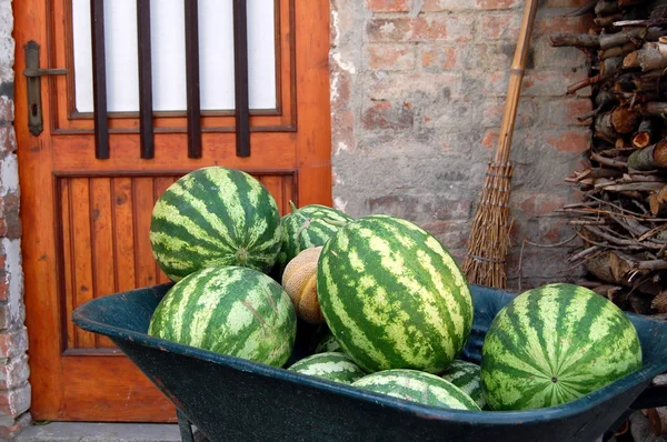 stock image Water melons in a green wheel barrow