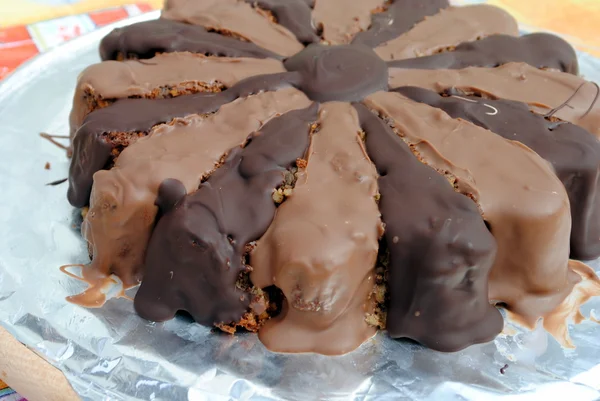 Almond cake covered with milk and dark chocolate — Stock Photo, Image