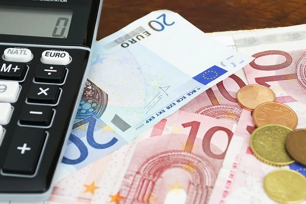 Euros with calculator — Stock Photo, Image