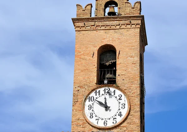 Часы и колокол — стоковое фото