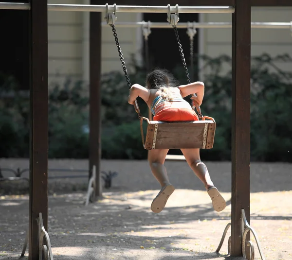 Little girl on a swing — Stock Photo, Image