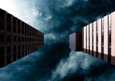 Dramatic sky behind two buildings clipart