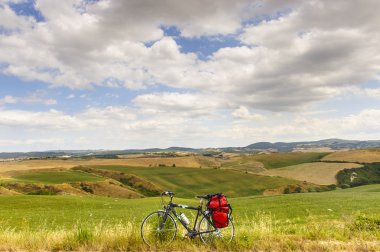 Landscape in Val d'Orcia (Tuscany) with bicycle clipart