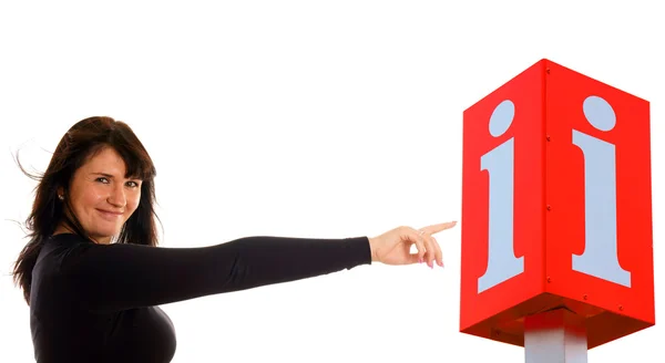 Femme pointant vers une icône d'information — Photo
