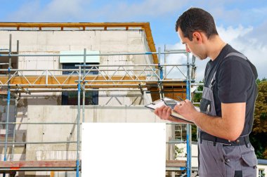 Construction worker in front of a building site clipart