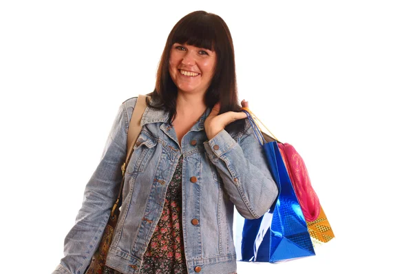 Aantrekkelijke jonge meisje met shopping tassen — Stockfoto