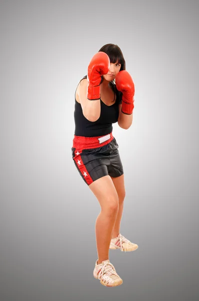 Menina atlética com luvas de boxe — Fotografia de Stock