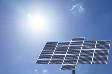 Solar panel with sun and blue sky clipart