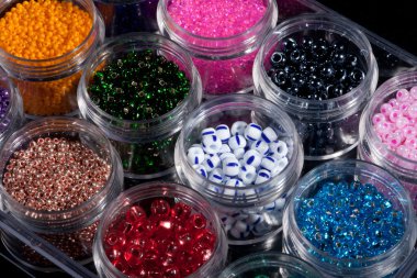 Glass beads in their cases clipart