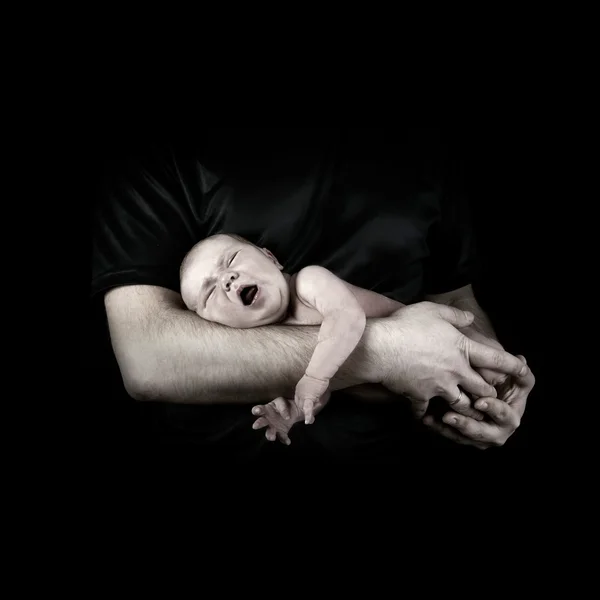 Newborn baby on the fathers hands — Stock Photo, Image