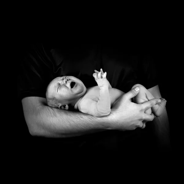Newborn baby on the fathers hands — Stock Photo, Image