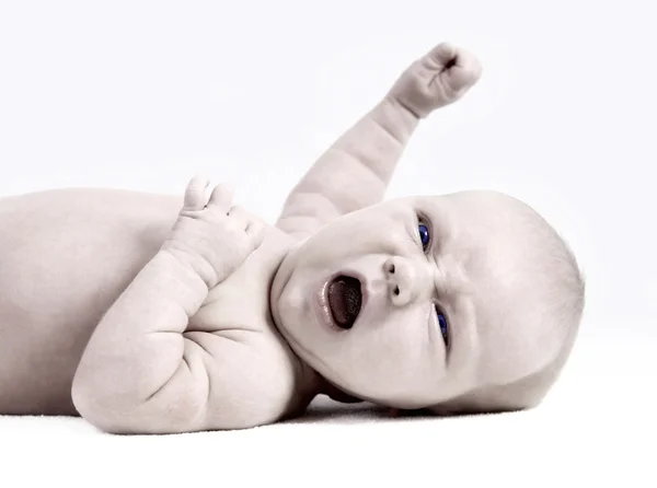 明るい背景に生まれたばかりの赤ちゃん — ストック写真