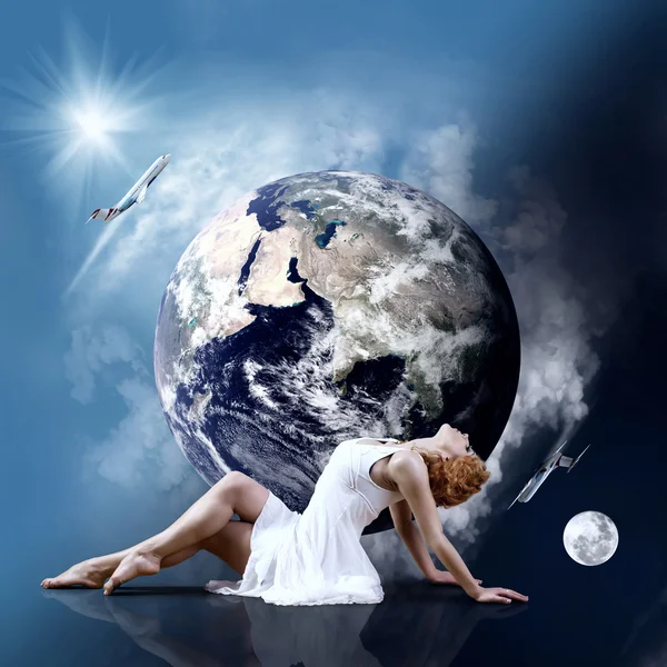 Ballerina verblijf in dansen pose op de planeet aarde. — Stockfoto