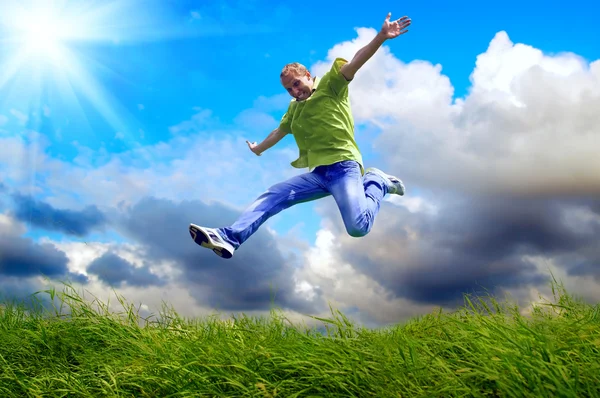 Fun man in jump on the outdoor background — Stock Photo, Image
