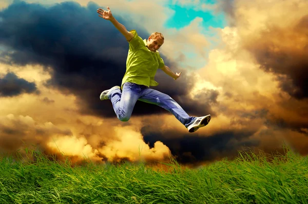 Fun man in jump on the outdoor background — Stock Photo, Image