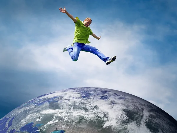 Fun couple in jump over the Planet Earth — Stock Photo, Image