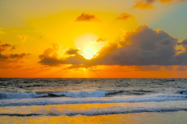 Colorfull sunrise at an brazilian beach clipart