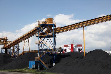 Black coal at the industrial port clipart