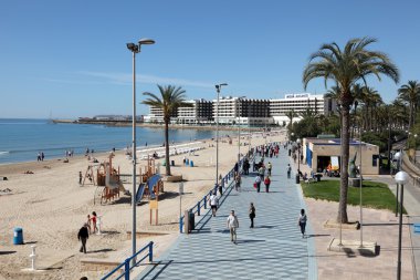 Beach and promenade in Alicante, Spain clipart
