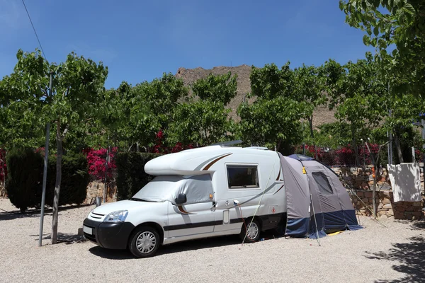 Camper van with tent on a camping site in Spain — Stock Photo, Image